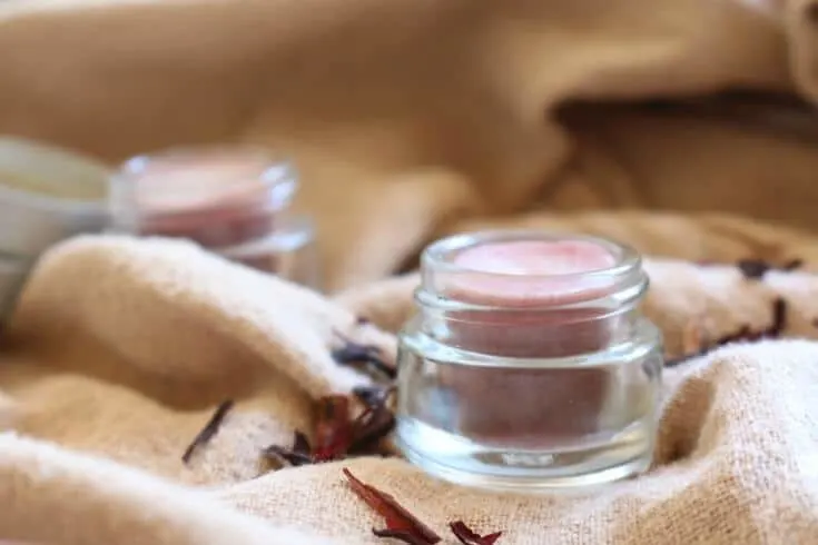 Subtly tinted with natural hibiscus powder, this DIY Tinted Lip Balm is soothing and, most importantly, chemical-free.