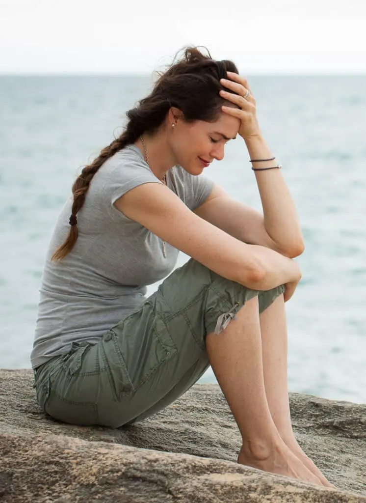 stressed out woman from grief experiencing hair loss