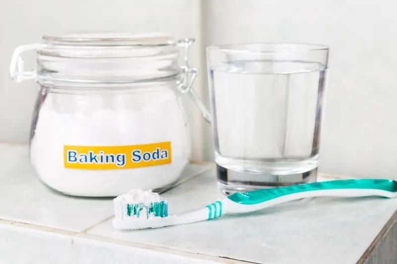 Baking soda is brilliant at removing the buildup of plaque which can give teeth a yellow tinge. Plus, the alkaline nature of baking soda gives it an extra discoloration-fading boost! 
