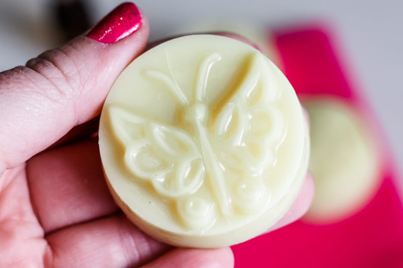 hand holding a butterfly homemade lotion bar