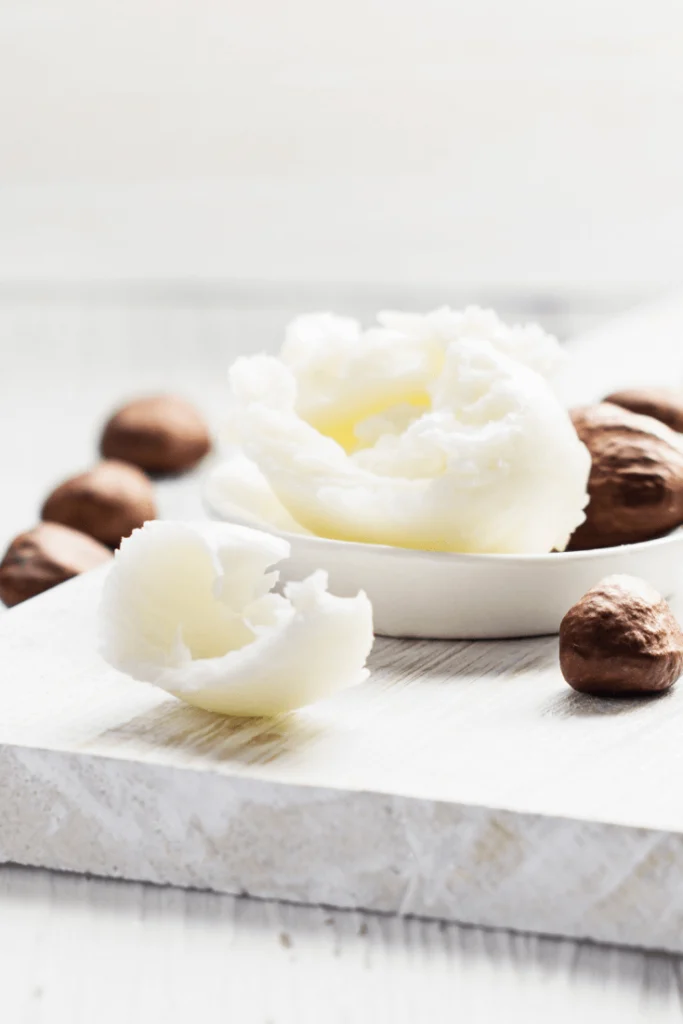 shea nuts and shea butter on a table