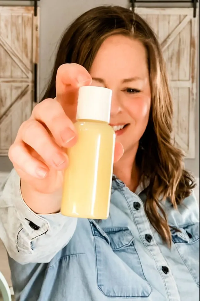 mindy benkert holding a bottle of diy shave butter