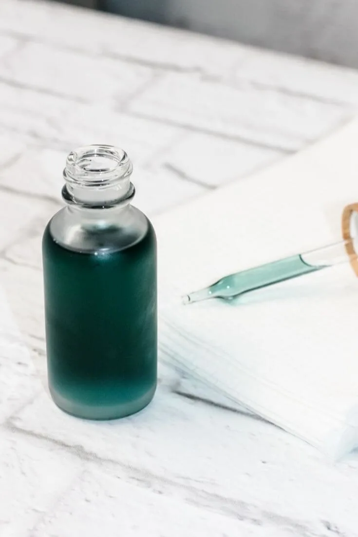 A Bottle of Watermelon Seed Oil. Packaging of Natural Essential Oil or  Serum for the Face with Watermelon on a White Background Stock Photo -  Image of growth, alternative: 253552098