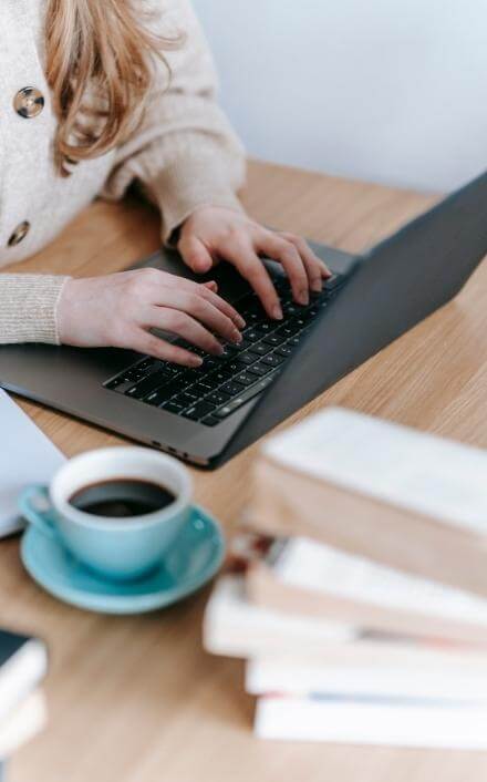 Spending hours and hours researching woman at computer researching